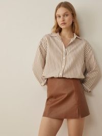 Reformation Veda Margie Leather Mini Skirt in Cognac | luxe brown split hem mini skirts