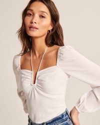 Abercrombie & Fitch Long-Sleeve Faux Silk Cinched Top – feminine ruched blouse / gathered detail tops