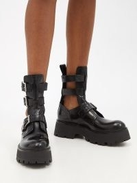 ALEXANDER MCQUEEN Cutout buckled leather ankle boots / women’s black chunky cut out footwear / biker inspired fashion