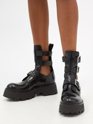 ALEXANDER MCQUEEN Cutout buckled leather ankle boots / women’s black chunky cut out footwear / biker inspired fashion - flipped