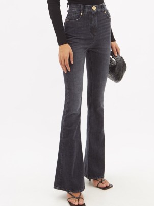 BALMAIN High-rise bootcut jeans | women’s faded black denim fashion | casual designer clothing
