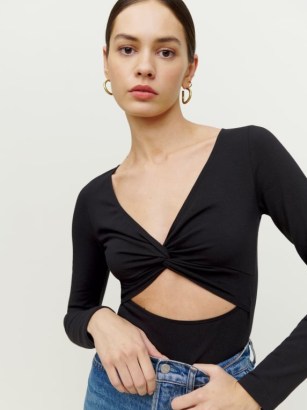 REFORMATION Kelia Knit Top in Black – long sleeved knot detail cut out tops