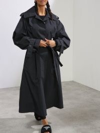 RAEY Wide raglan-sleeved belted trench coat | women’s navy blue longline oversized tie waist coats | womens on-trend outerwear