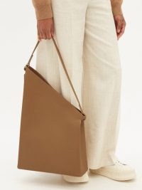 AESTHER EKME Sway asymmetrical leather shoulder bag | contemporary asymmetric bags | minimalist handbags