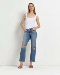 River Island BLUE RIPPED LOW RISE STRAIGHT JEANS | women’s denim clothes made from Responsibly Sourced Cotton