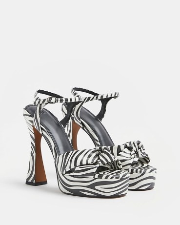 Monochrome animal print platforms | black and white printed platform sandals | glamorous retro shoes | 70s inspired knot detail high heels - flipped