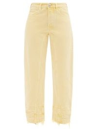 JIL SANDER Raw-edge curved-seam jeans – yellow denim clothes – cropped raw edge hems – crop leg – women’s casual fashion
