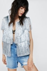 NASTY GAL Cropped Sleeveless Tinsel Jacket – silver fringed jackets – festival fashion – 70s inspired metallic clothes – womens 1970s style glam rock clothing