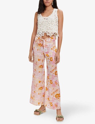MAJE Flower Power floral-print flared mid-rise recycled-polyester trousers – retro flower prints – vintage style tie up waist flares