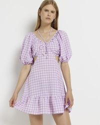 River Island PURPLE GINGHAM CUT OUT MINI DRESS – womens checked puff sleeved cotton dresses – tie neck detail fashion – women’s cutout clothes – tiered hem