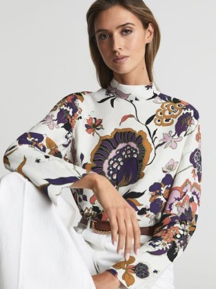 REISS ANNIE RETRO PRINT BLOUSE – chic long sleeve high neck blouses / relaxed shift silhouette tops / womens clothes with bold floral prints / add white flares and a pair of strappy wedges for a chic 70s inspired summer look