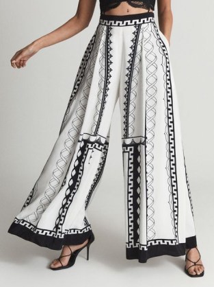 REISS EMMALIE MAXI OCCASION TROUSERS – women’s voluminous wide leg trousers – chic printed palazzo pants – floaty occasion clothes – voluminous summer event fashion