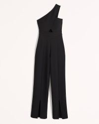 Abercrombie & Fitch Asymmetrical One-Shoulder Jumpsuit – black front cut out jumpsuits – split hem detail – asymmetric evening fashion – glamorous all-in-one party clothes – Best Dressed Guest Collection