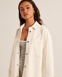 Abercrombie & Fitch Denim Shirt Jacket in Cream | curved hem overshirts | on-trend summer shackets | women’s casual fashion