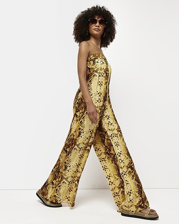 River Island YELLOW SNAKE PRINT BANDEAU JUMPSUIT – strapless tie back detail jumpsuits – womens wide leg animal printed all-in-one – women’s summer fashion - flipped