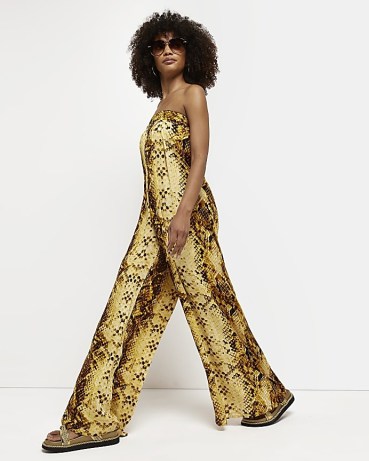 River Island YELLOW SNAKE PRINT BANDEAU JUMPSUIT – strapless tie back detail jumpsuits – womens wide leg animal printed all-in-one – women’s summer fashion
