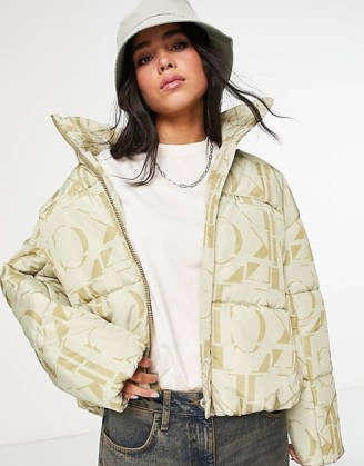 Calvin Klein Jeans recycled polyester all over logo oversized puffer jacket in cream / women’s padded designer jackets / asos - flipped