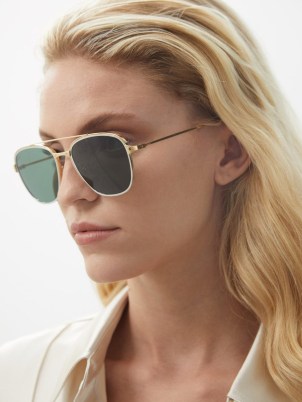 CARTIER EYEWEAR Santos de Cartier aviator metal sunglasses | womens chic aviators | women’s designer eyewear | gold tone rim with green lenses | MATCHESFASHION