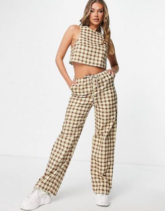 Motel high neck cross back crop top and low rise relaxed trousers with drawstring / women’s brown checked fashion sets / crop hem tops / womens check print clothing co-ords / asos - flipped