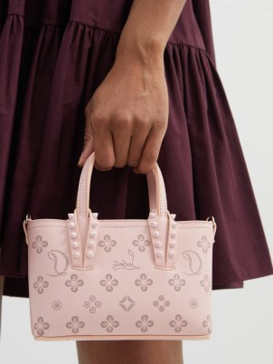 CHRISTIAN LOUBOUTIN Cabata perforated-leather mini tote bag ~ small light pink Loubinthesky motif bags ~ luxe top handle handbags ~ women’s designer accessories at MATCHESFASHION ~ chic accessory - flipped