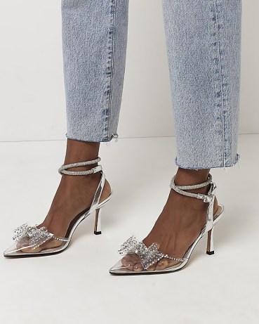 RIVER ISLAND SILVER PERSPEX COURT SHOES ~ metallic diamante embellished courts ~ front bow ankle wrap party heels ~ clear pointed toe - flipped