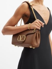 VALENTINO GARAVANI Stud Sign leather shoulder bag ~ tan studded designer bags ~ luxury brown handbags with gold shoulder chain ~ MATCHESFASHION