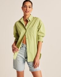 Abercrombie & Fitch Oversized Poplin Button-Up Shirt in Lime ~ women’s green curved hem shirts ~ womens casual on-trend wardrobe essentials