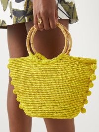 SENSI STUDIO Baby bamboo-handle pompom straw basket bag | small O hangle tote | yellow woven summer handbags | pompom trimmed holiday bags | bright and breezy vacation accessories | MATCHESFASHION