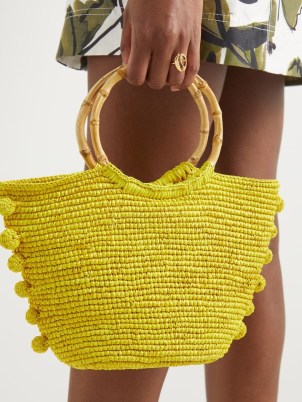 SENSI STUDIO Baby bamboo-handle pompom straw basket bag | small O hangle tote | yellow woven summer handbags | pompom trimmed holiday bags | bright and breezy vacation accessories | MATCHESFASHION - flipped