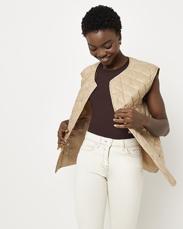 RIVER ISLAND BEIGE QUILTED GILET ~ curved hem gilets ~ womens sleeveless quilt detail autumn jackets - flipped