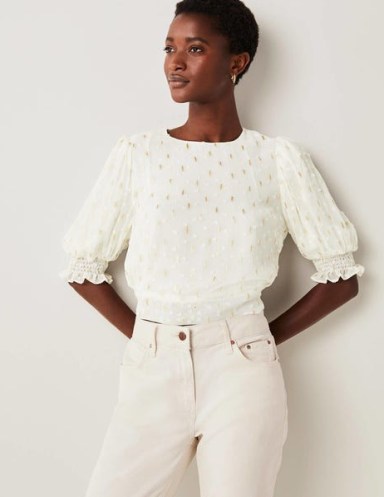 Boden Cropped Metallic Smocked Top Ivory and Gold Clip / women’s short puff sleeved textured spot tops / feminine smock detail hem and cuffs / dobby effect fabric - flipped
