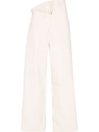 Paris Georgia Gala asymmetric wide-leg jeans in beige | women’s edgy denim fashion | back buckle detail | womens asymmetrical clothes | FARFETCH