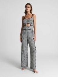REISS REMI PRINTED WIDE LEG RESORT JUMPSUIT BLACK/WHITE ~ strappy printed cut out jumpsuits ~ chic spaghetti shoulder strap all-in-one ~ stylish vacation fashion