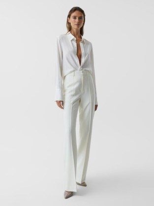 REISS TAITE FLARED TUXEDO TROUSERS WHITE | women’s tailored seamed pants | front pinched seams | womens chic flares - flipped