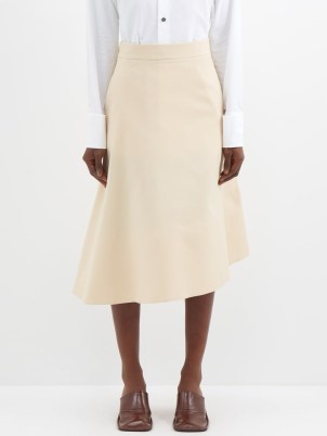 JIL SANDER Asymmetric-hem gabardine midi skirt in beige ~ women’s asymmetrical designer clothes ~ MATCHESFASHION - flipped