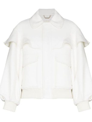 Chloé cape-effect bomber jacket in milk / womens white ruffled jackets / women’s designer outerwear / FARFETCH - flipped