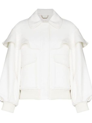 Chloé cape-effect bomber jacket in milk / womens white ruffled jackets / women’s designer outerwear / FARFETCH