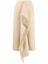 Nanushka blanket wrap skirt in cream beige | fringed front drape skirts | women’s designer fashion | FARFETCH