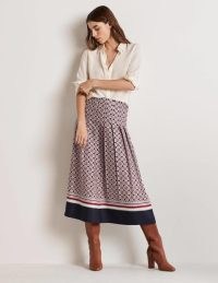 Boden Pleated Printed Midi Skirt Almond Pink, French Navy Geo – women’s pleated geometric print skirts – mixed prints