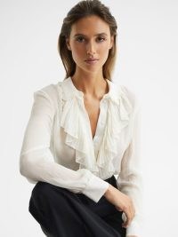 REISS DILON RUFFLE FRONT BLOUSE CREAM – romantic ruffled blouses – feminine romance inspired clothes – frill detail tops