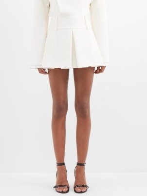 MAXIMILIAN DAVIS Madeline inverted-pleat crepe mini skirt in ivory | women’s chic pleated short length skirts | MATCHESFASHION | womens designer fashion - flipped