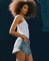 Abercrombie & Fitch Mid Rise Curved Hem Denim Skirt | blue front zip fly closure mini skirts