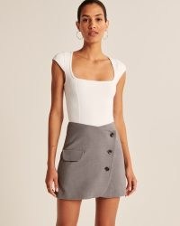 Abercrombie & Fitch Wrapped Suiting Mini Skirt in Grey | asymmetric front wrap skirts