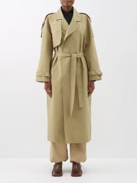 THE FRANKIE SHOP Suzanne cotton-canvas trench coat in beige | women’s chic tie waist belted coats | MATCHESFASHION