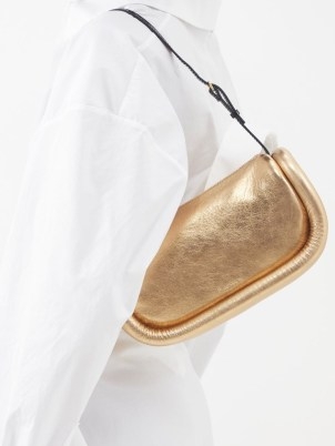 JW ANDERSON Bumper Baguette metallic-leather shoulder bag in gold – luxe 90s style handbags – glamorous 1990s style designer bags – MATCHESFASHION - flipped