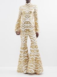 HALPERN Tiger-stripe sequinned flared jumpsuit in gold and white – glamorous retro jumpsuits – matchesfashion – 70s vintage style occasion fashion – funky 1970s inspired event clothes – women’s animal sequin covered evening wear