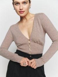 Reformation Mercato Cashmere Novelty Sweater in Oatmeal | long sleeve deep V-neck sweaters | women’s plunge front fitted jumpers | underbust seam detail | button front closure