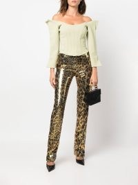 Paco Rabanne sequin-embellished leopard-print trousers in gold tone – glamorous metallic fashion – sequinned animal print pants