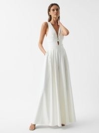 Reiss KADY WIDE LEG JUMPSUIT IVORY | sleeveless plunge front evening occasion jumpsuits | plunging neckline event fashion | cut out detail | sophisticated party glamour