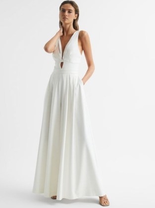 Reiss KADY WIDE LEG JUMPSUIT IVORY | sleeveless plunge front evening occasion jumpsuits | plunging neckline event fashion | cut out detail | sophisticated party glamour - flipped